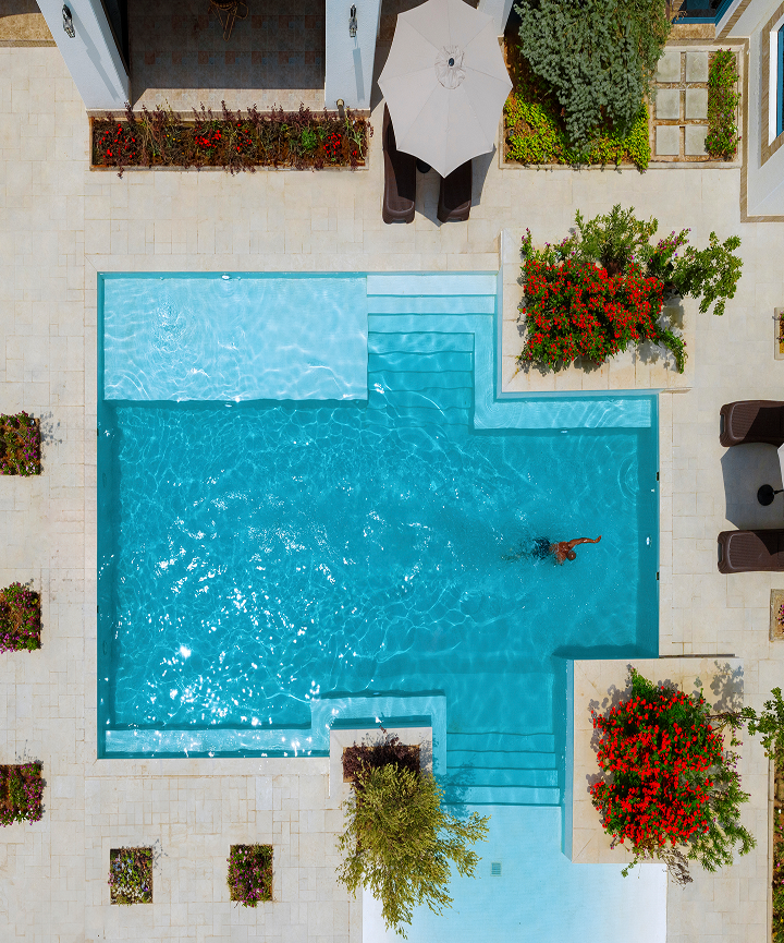 top view image of a man swimming in a pool